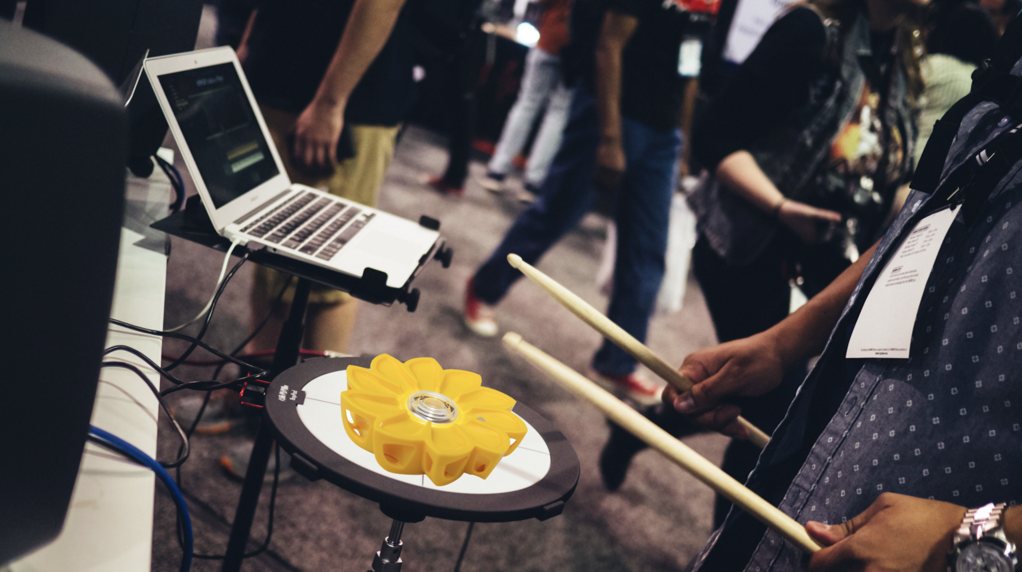 A Little Sun lamp on a drum pad, played with drumsticks